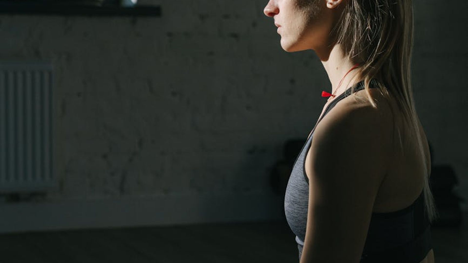 Calm and focused woman in a serene yoga space.